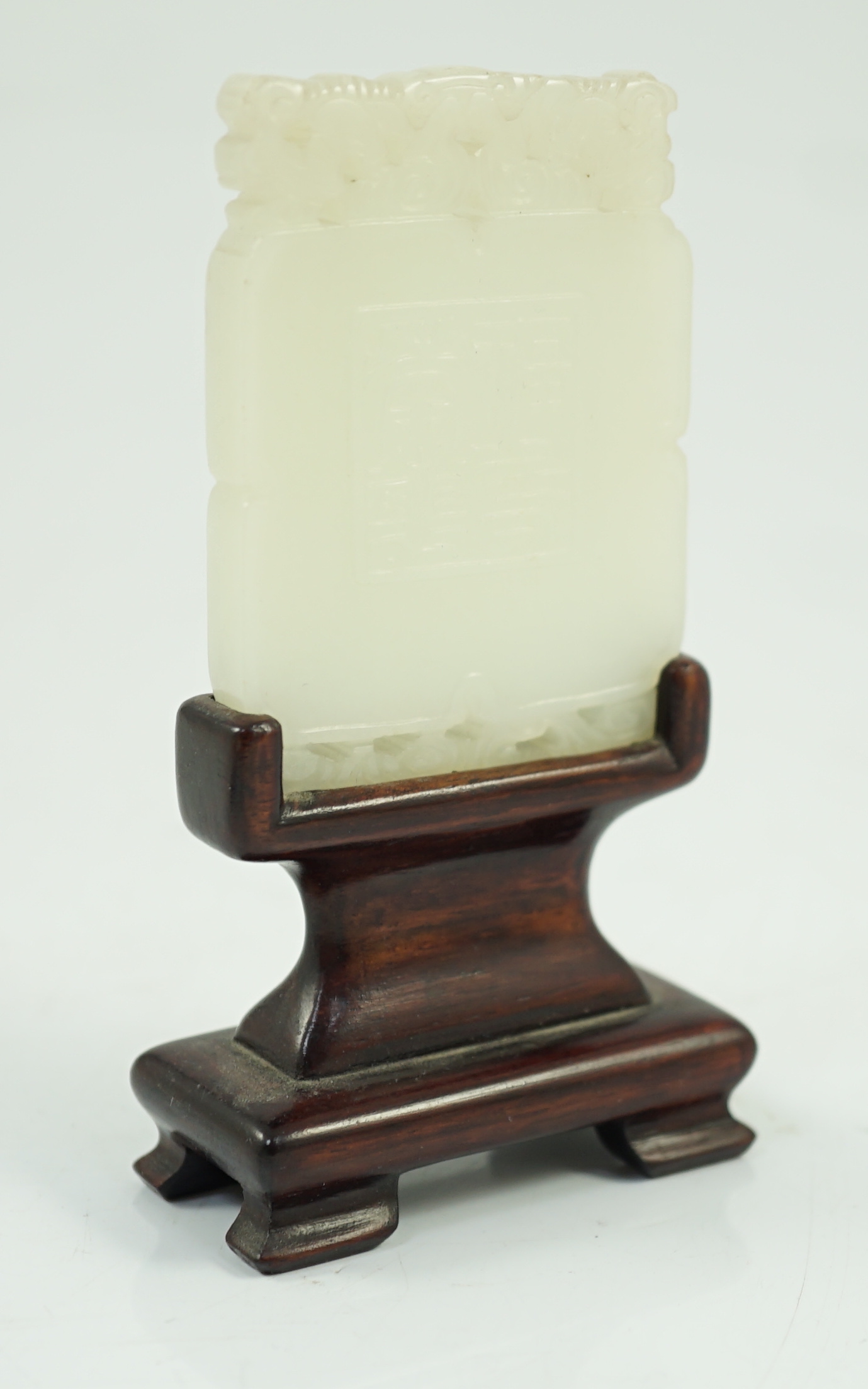 A Chinese carved white jade pendant plaque, 18th/19th century